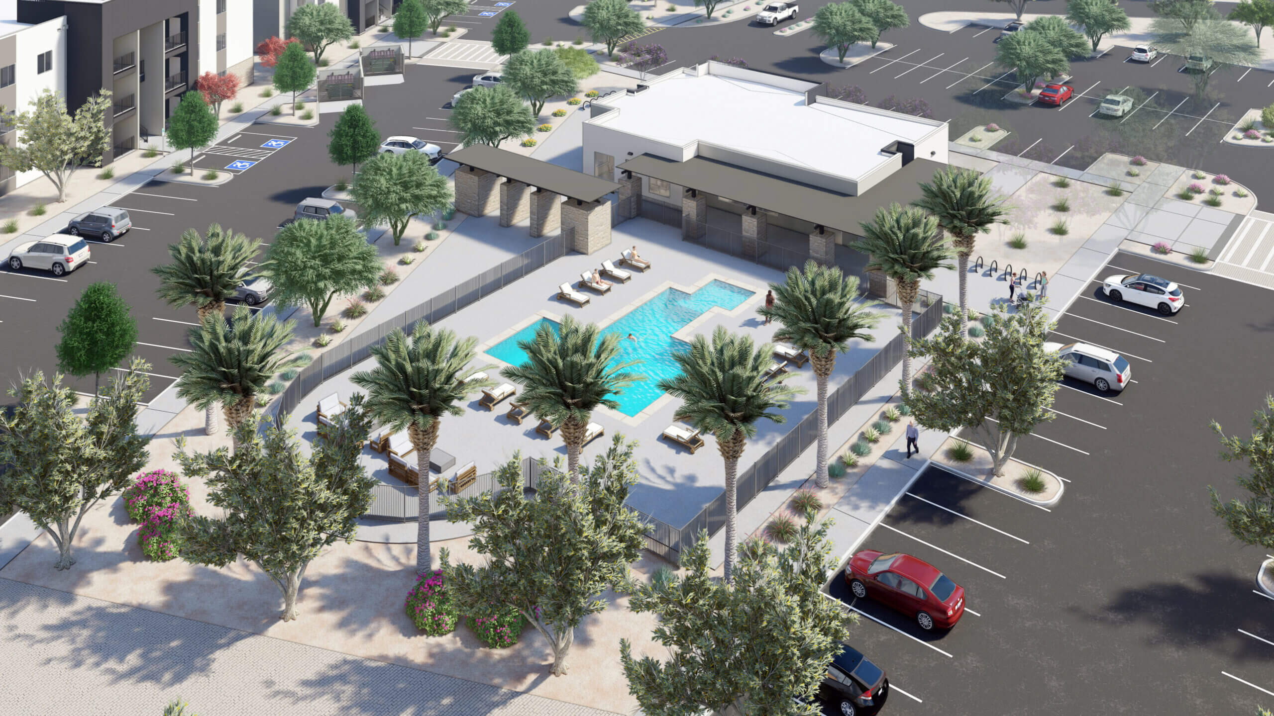 Aerial view of a pool and surrounding parking area.