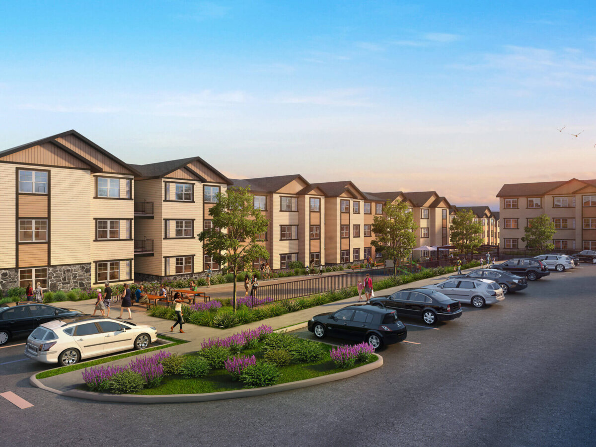 Apartment complex exterior with parking lot.